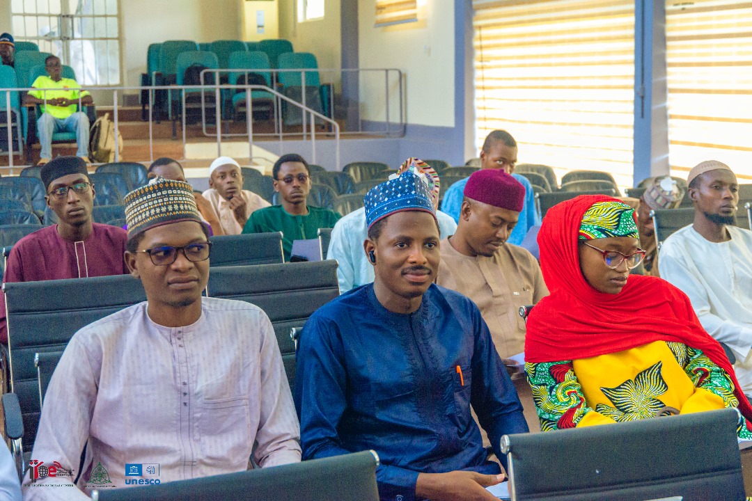 Delegates in traditional attire during a session